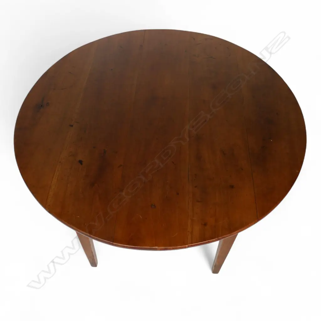 A French c.1900 fruitwood circular kitchen table, Image 1++